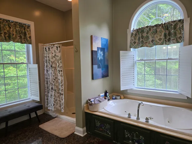 a bedroom with a bed and a desk