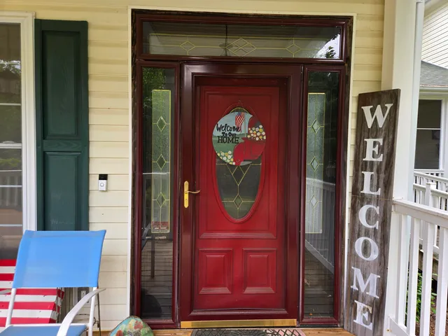 a backyard of a house with table and chairs