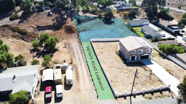an aerial view of a houses with a outdoor space
