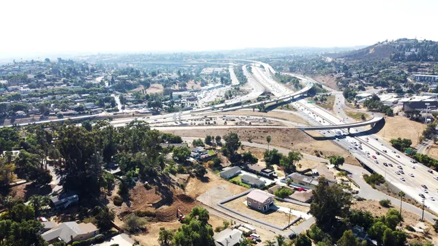 an aerial view of residential houses and outdoor space