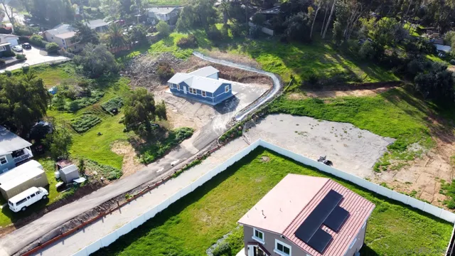 a view of a yard covered in snow