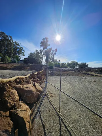 a view of a big yard with lots of green space