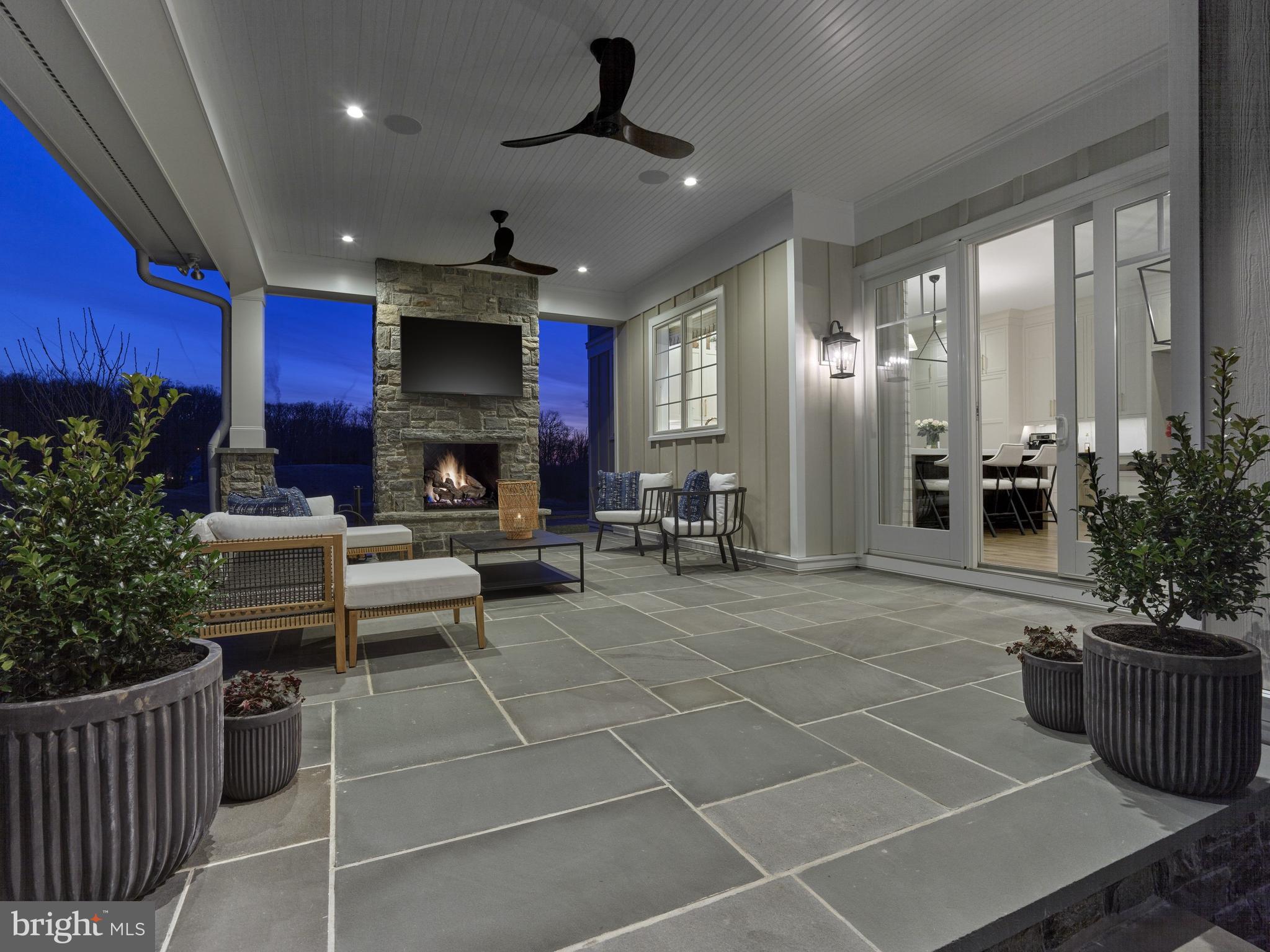 303 Walnut Avenue Wayne, PA 19087 - Photo 13 of 68 a living room with patio furniture and a fireplace