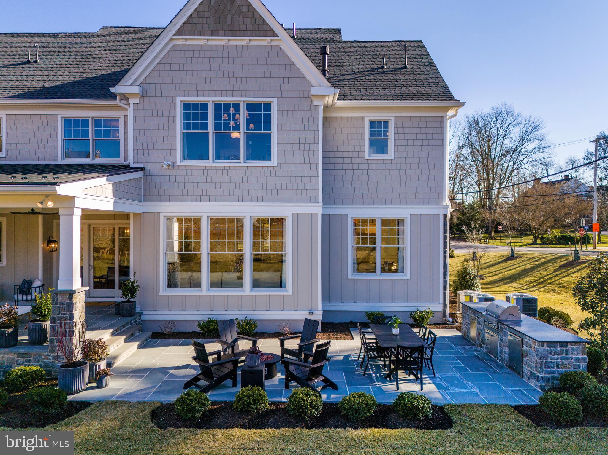 303 Walnut Avenue Wayne, PA 19087 - Photo 8 of 68 a front view of a house with garden and patio