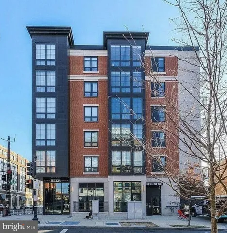 a front view of a building with lot of windows