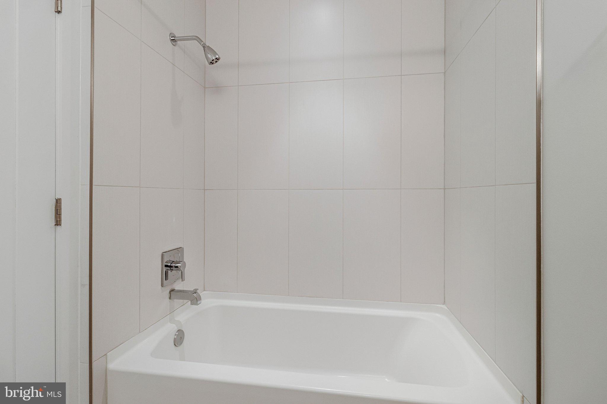 301 H Street Northeast, Unit PH602 Washington, DC 20002 - Photo 10 of 14 a bathroom with a bathtub