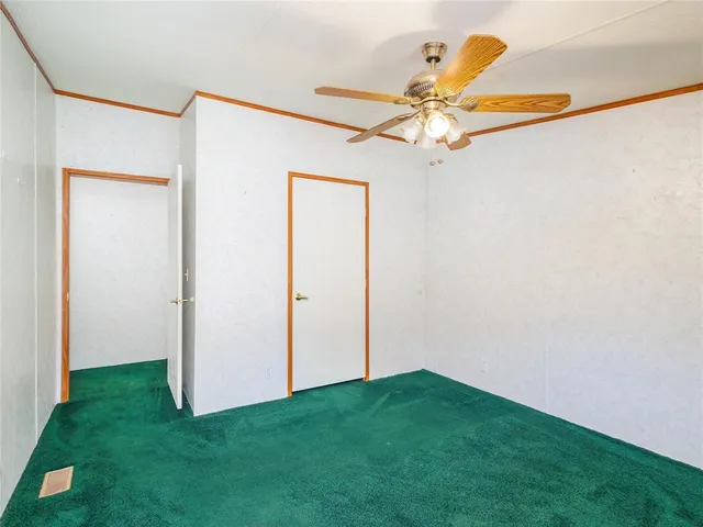 a view of a yard with a ceiling fan