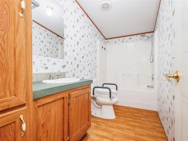 a bathroom with a bathtub and shower