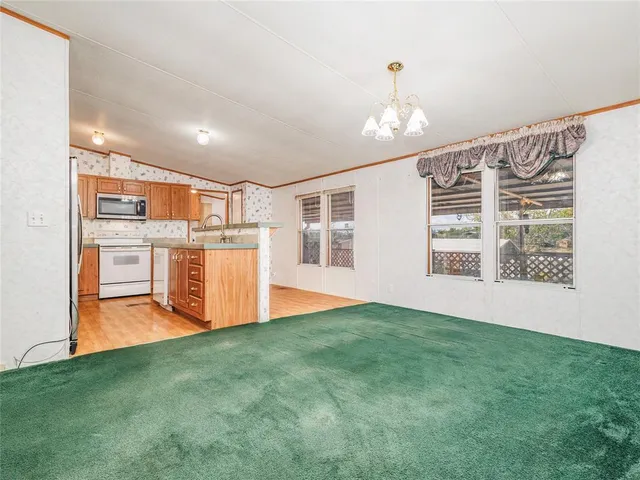 a view of livingroom with furniture and windows