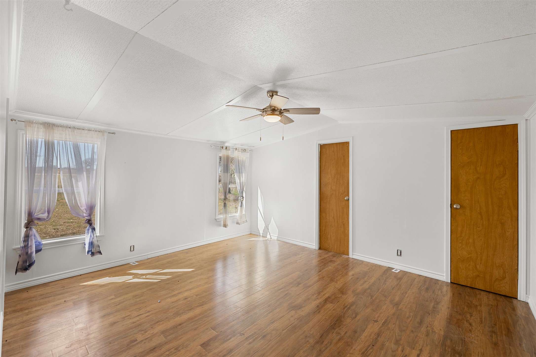 1919 County Road 344 Loop Milano, TX 76556 - Photo 11 of 21 wooden floor in an empty room with a window