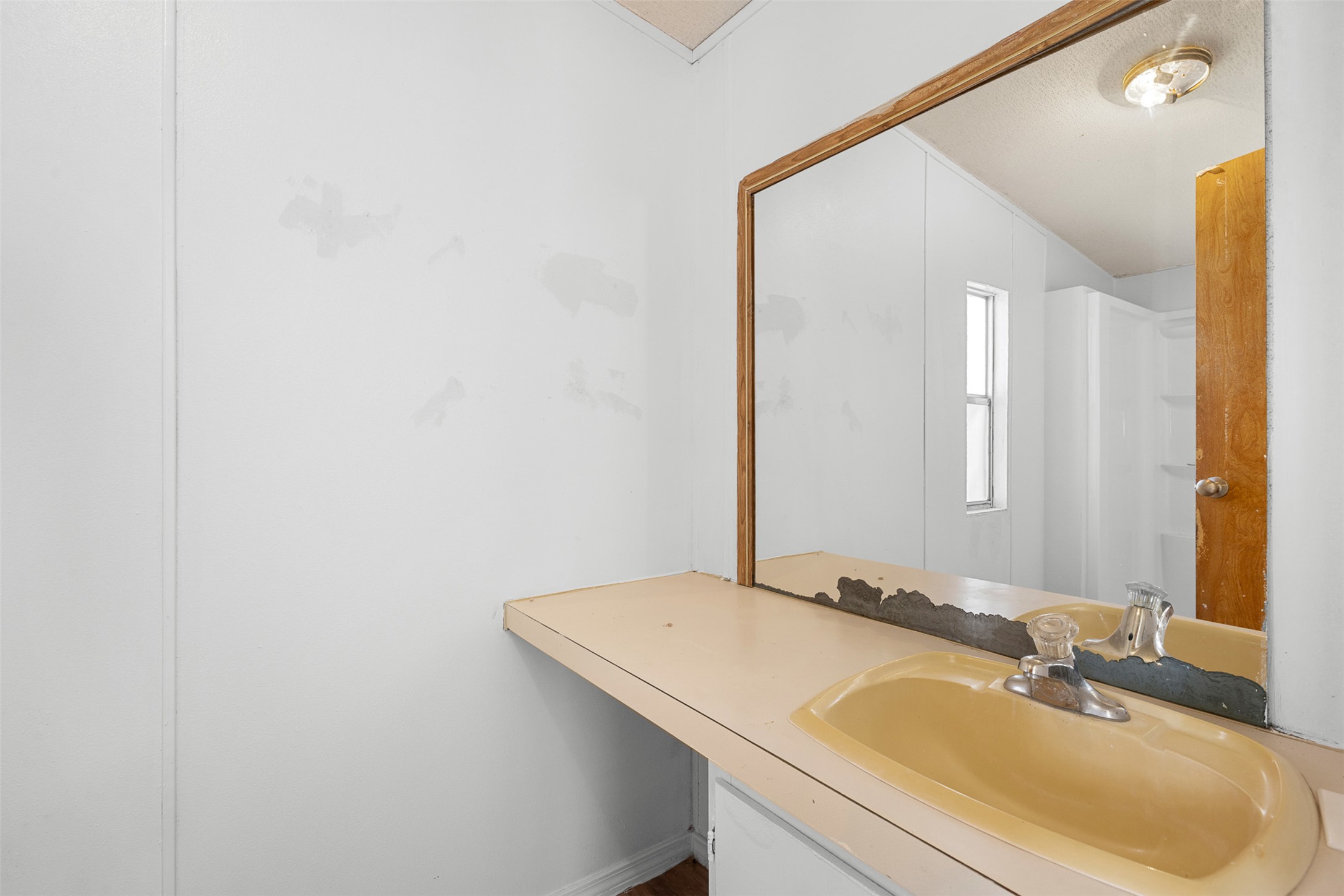 1919 County Road 344 Loop Milano, TX 76556 - Photo 13 of 21 a bathroom with a sink and a mirror