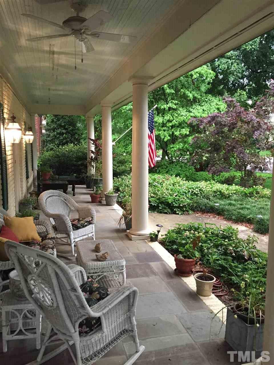 1804 St Marys Street Raleigh, NC 27608 - Photo 3 of 25 a patio with yard table and chairs