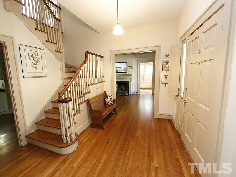 1804 St Marys Street Raleigh, NC 27608 - Photo 4 of 25 a view of a hallway with wooden floor and staircase