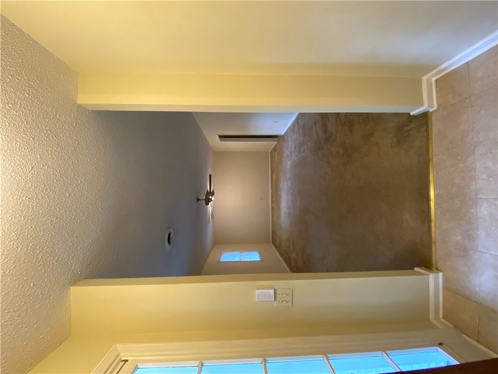 1424 East Calhoun Street Anderson, SC 29621 - Photo 2 of 10 An inviting passage connects different areas, offering a glimpse of varied flooring and architectural details.