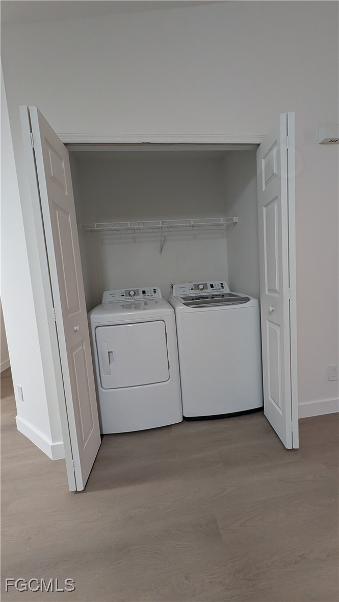 5114 27th Street Southwest Lehigh Acres, FL 33973 - Photo 10 of 26 a utility room with dryer and washer