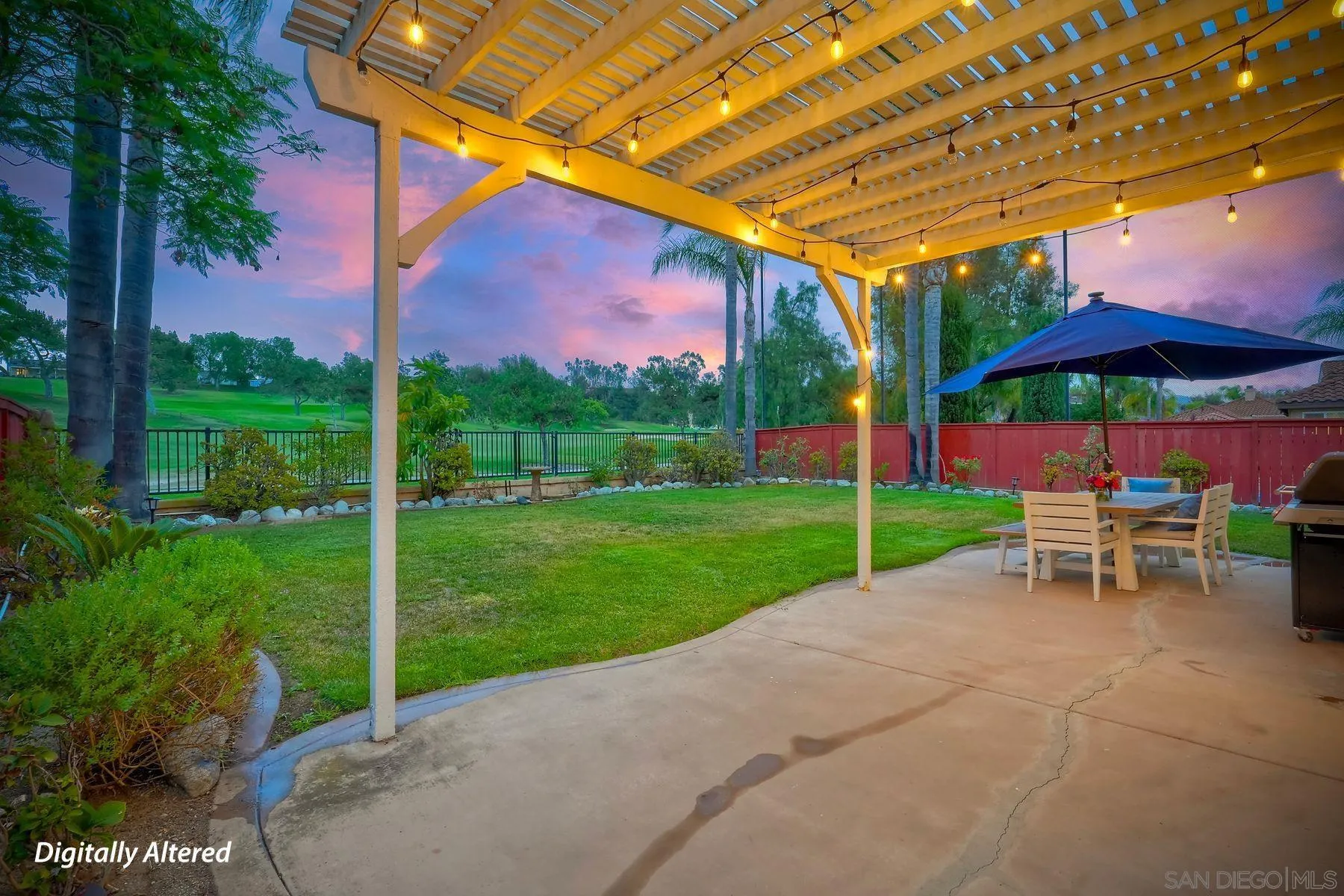 529 Peach Tree Way San Marcos, CA 92069 - Photo 24 of 30 a view of a table and chairs under an umbrella