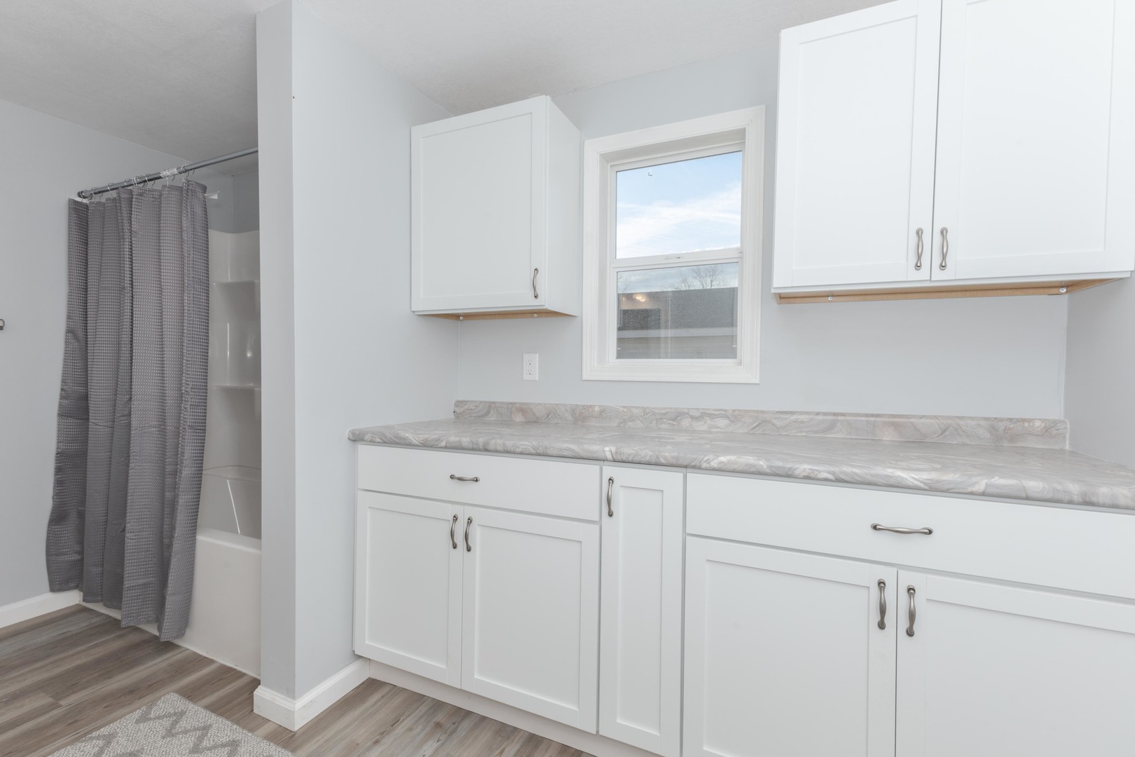401 6th Street Cornell, IL 61319 - Photo 16 of 33 a kitchen with granite countertop white cabinets and a sink