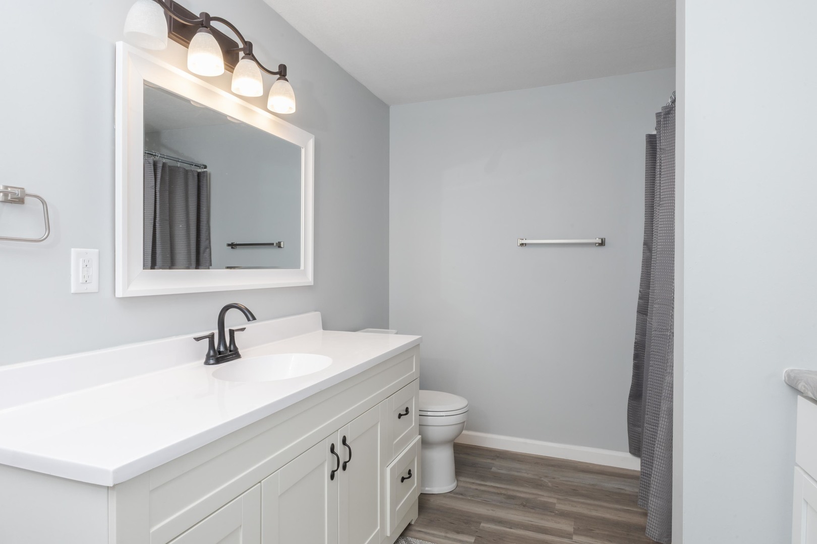 401 6th Street Cornell, IL 61319 - Photo 17 of 33 a bathroom with a toilet sink and mirror