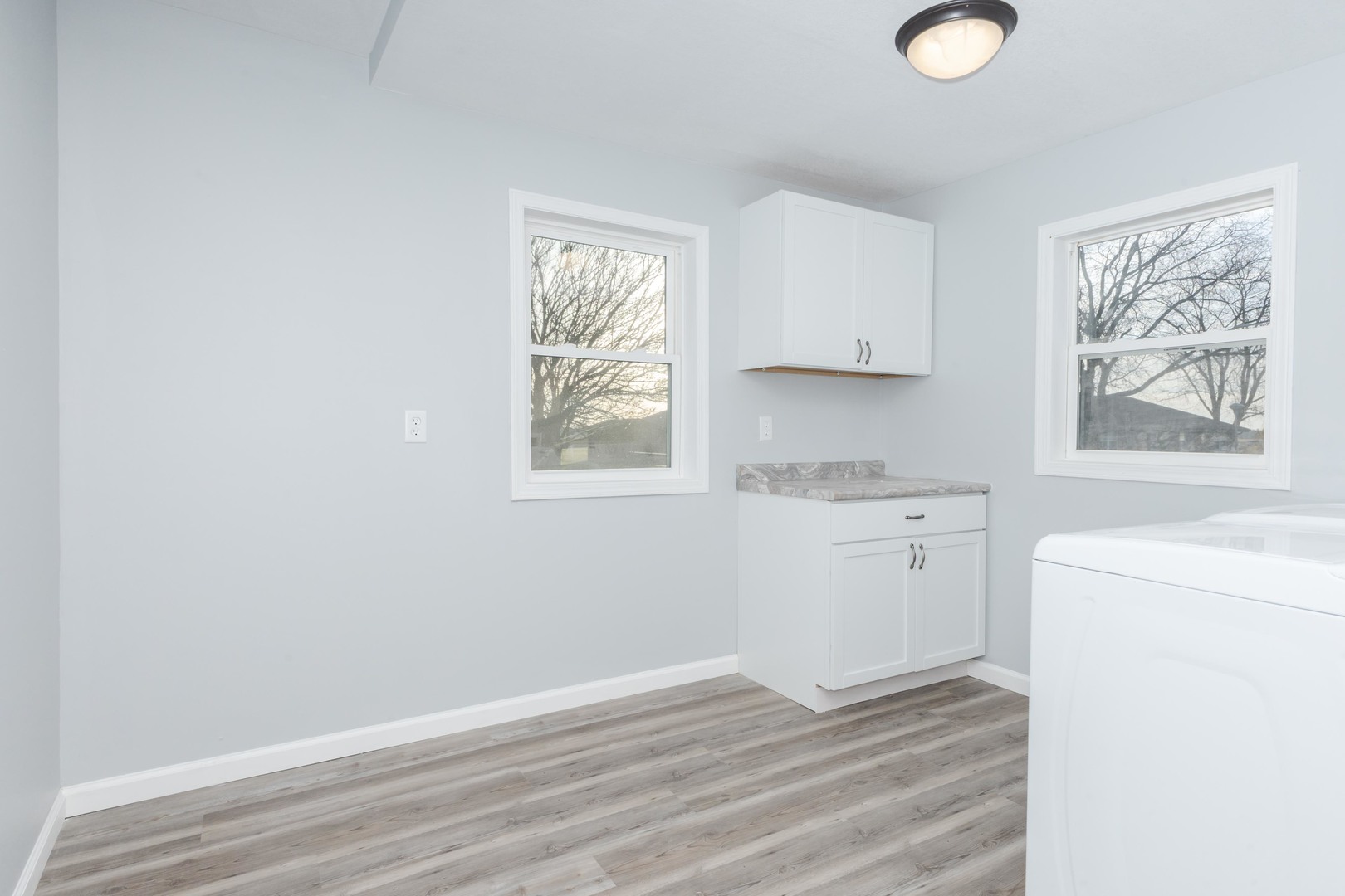 401 6th Street Cornell, IL 61319 - Photo 18 of 33 a view of a kitchen with wooden floor and electronic appliances