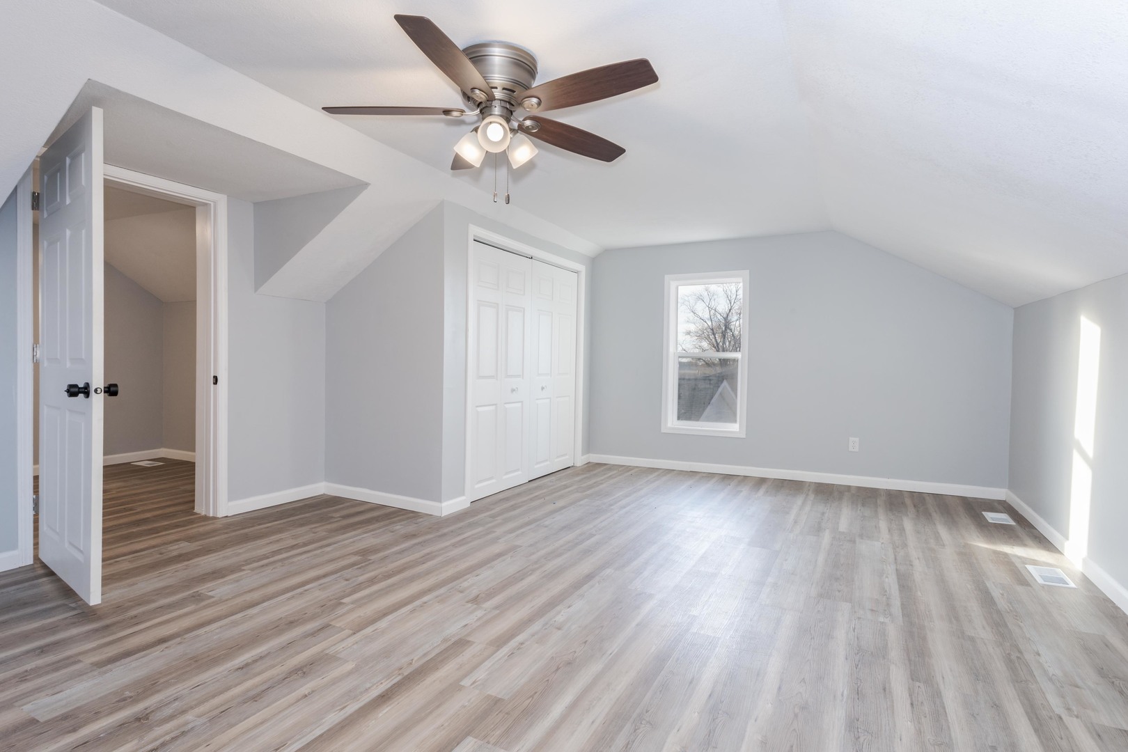 401 6th Street Cornell, IL 61319 - Photo 24 of 33 a view of an empty room with wooden floor and a window