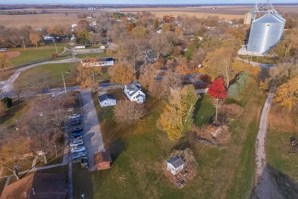an aerial view of a house with a yard