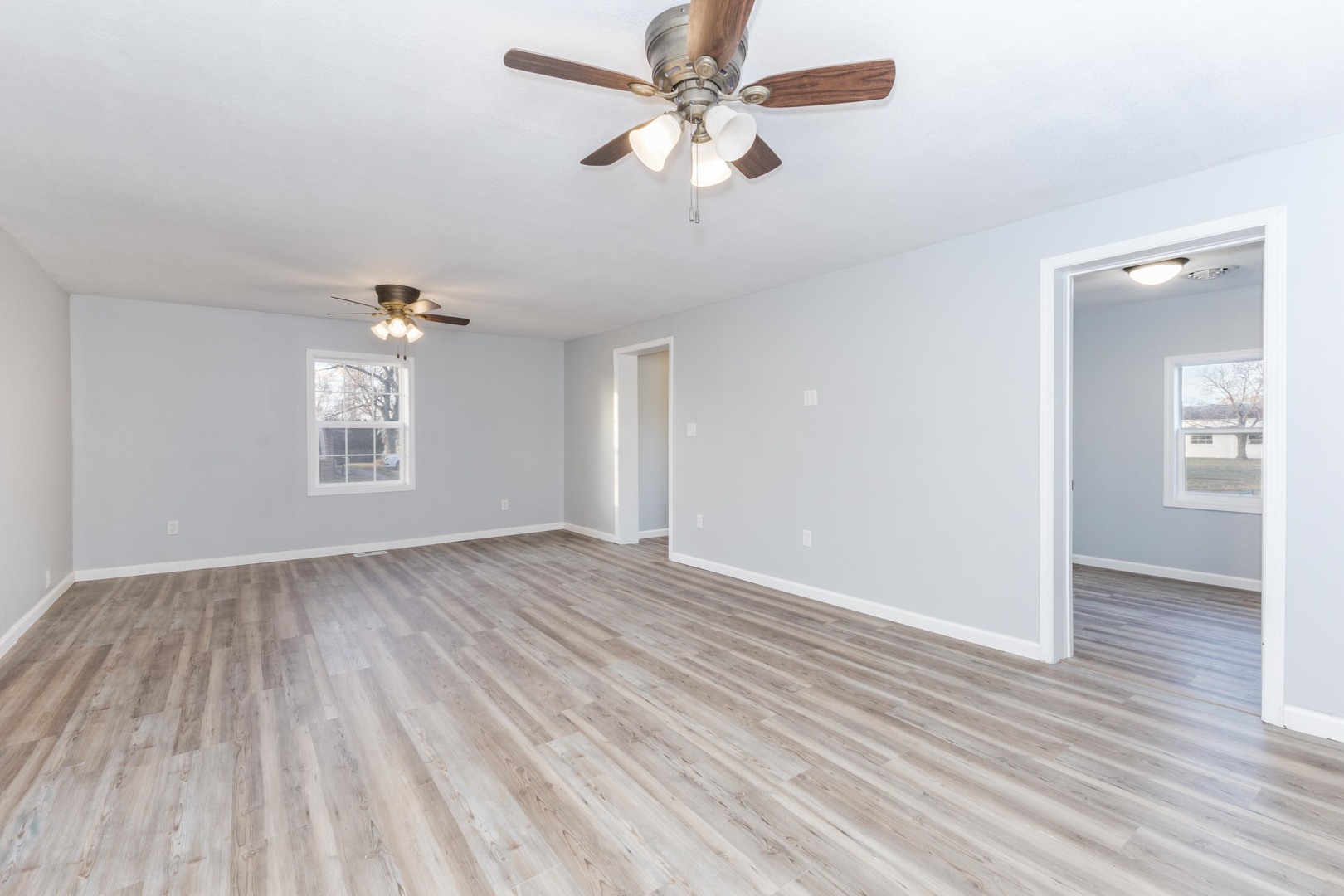 401 6th Street Cornell, IL 61319 - Photo 8 of 33 wooden floor in an empty room with a window