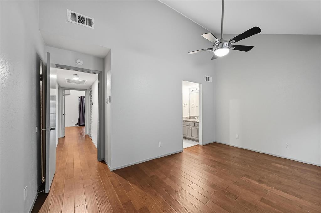 4521 North O'Connor Road, Unit 2169 Irving, TX 75062 - Photo 11 of 17 wooden floor in an empty room with a window