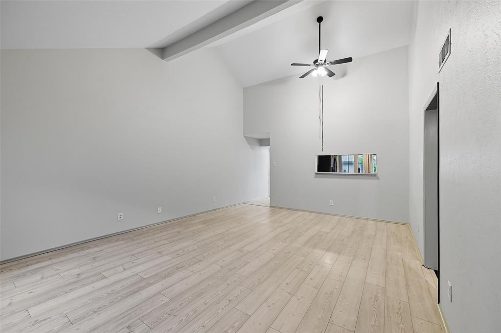 4521 North O'Connor Road, Unit 2169 Irving, TX 75062 - Photo 2 of 17 a view of a room with wooden floor and a ceiling fan