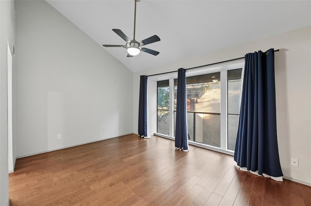 4521 North O'Connor Road, Unit 2169 Irving, TX 75062 - Photo 10 of 17 a view of an empty room with a window and wooden floor