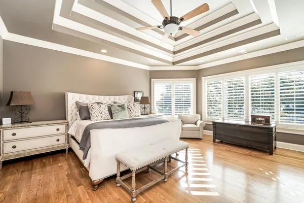 a spacious bathroom with a granite countertop sink mirror and a
