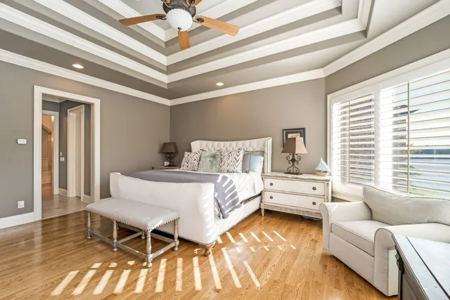 a bathroom with a granite countertop sink a mirror and a shower