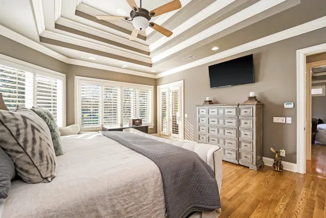 a bathroom with a tub a sink and mirror