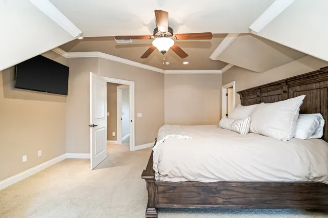 a dining room with furniture and a kitchen view