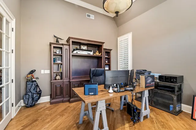 a bathroom with a granite countertop toilet sink and mirror