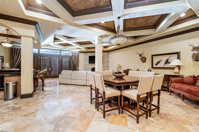a bathroom with a granite countertop sink a toilet and a mirror