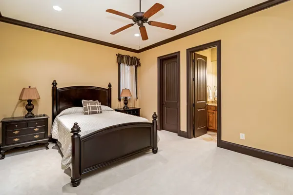 a bathroom with a toilet a sink and a window