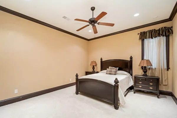 a living room with furniture a ceiling fan and a window
