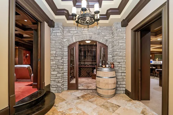 a living room with patio furniture and a large tree
