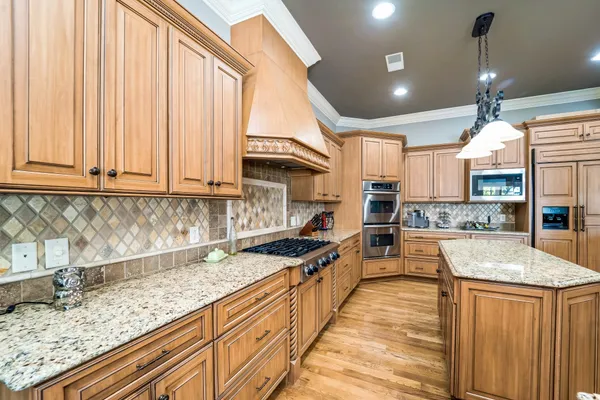 a view of a dining room with furniture wooden floor and chandelier