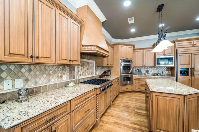 a view of a dining room with furniture wooden floor and chandelier