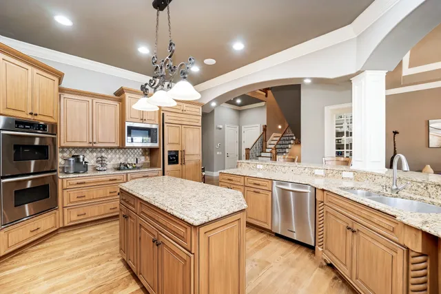 a view of a patio with a table chairs and a backyard