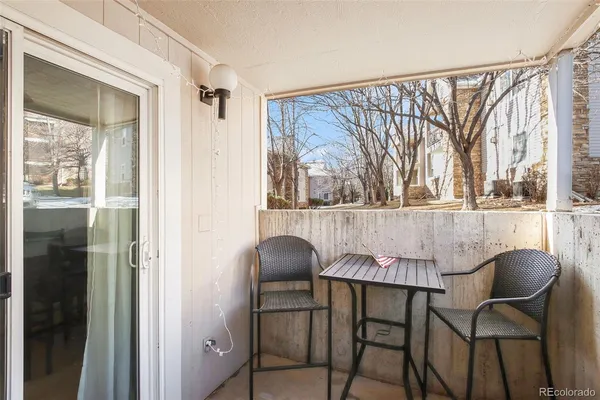 a dining room with a table and chairs