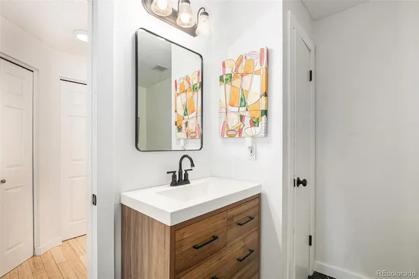 a bathroom with 2 sink and a mirror