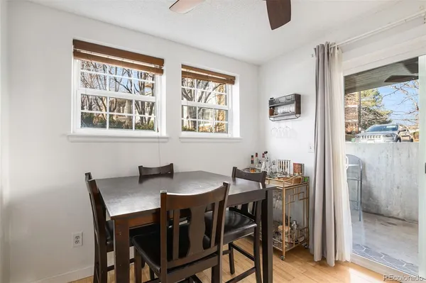 a dining room with furniture and window