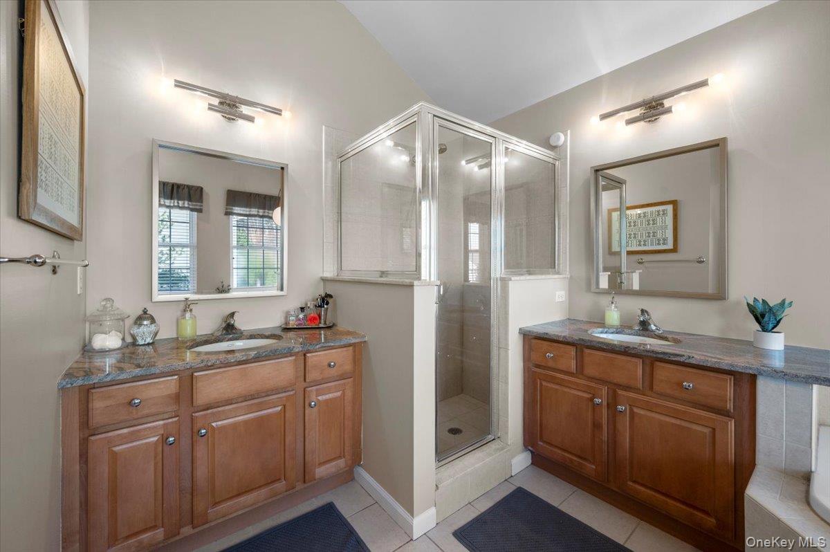 11 Heather Ridge Highland Mills, NY 10930 - Photo 21 of 38 a en suite bathroom with a granite countertop sink a toilet and mirror