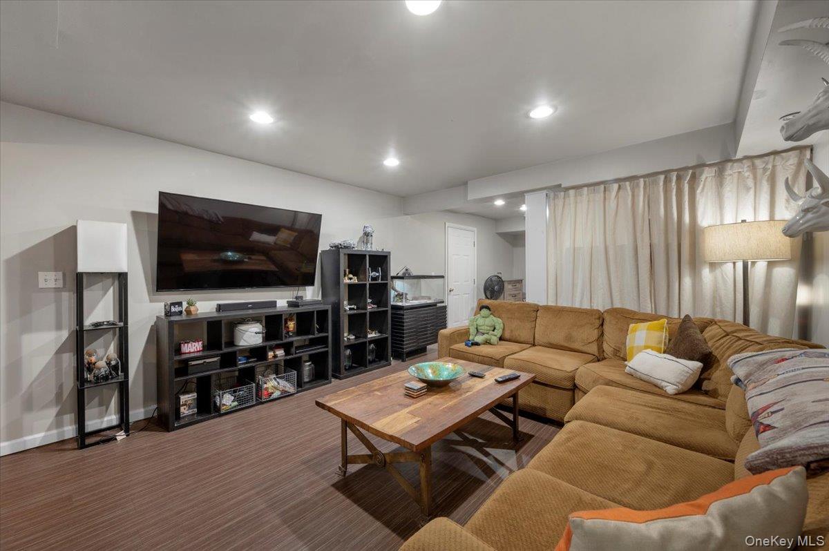 11 Heather Ridge Highland Mills, NY 10930 - Photo 29 of 38 a living room with furniture and a flat screen tv