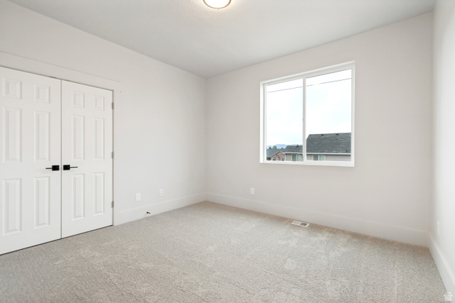 529 North Hvn Drive Mapleton, UT 84664 - Photo 26 of 30 Bright room featuring light gray carpeting, white walls, and a recessed ceiling light