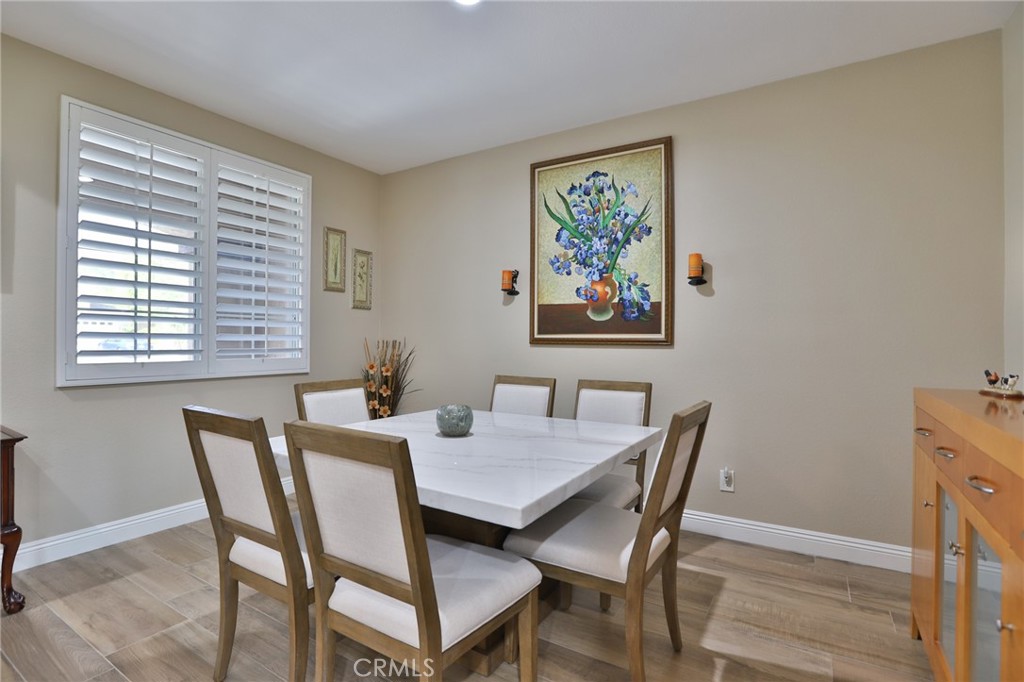1789 Kapalua Bay Lane Corona, CA 92883 - Photo 11 of 63 a view of a dining room with furniture window and wooden floor