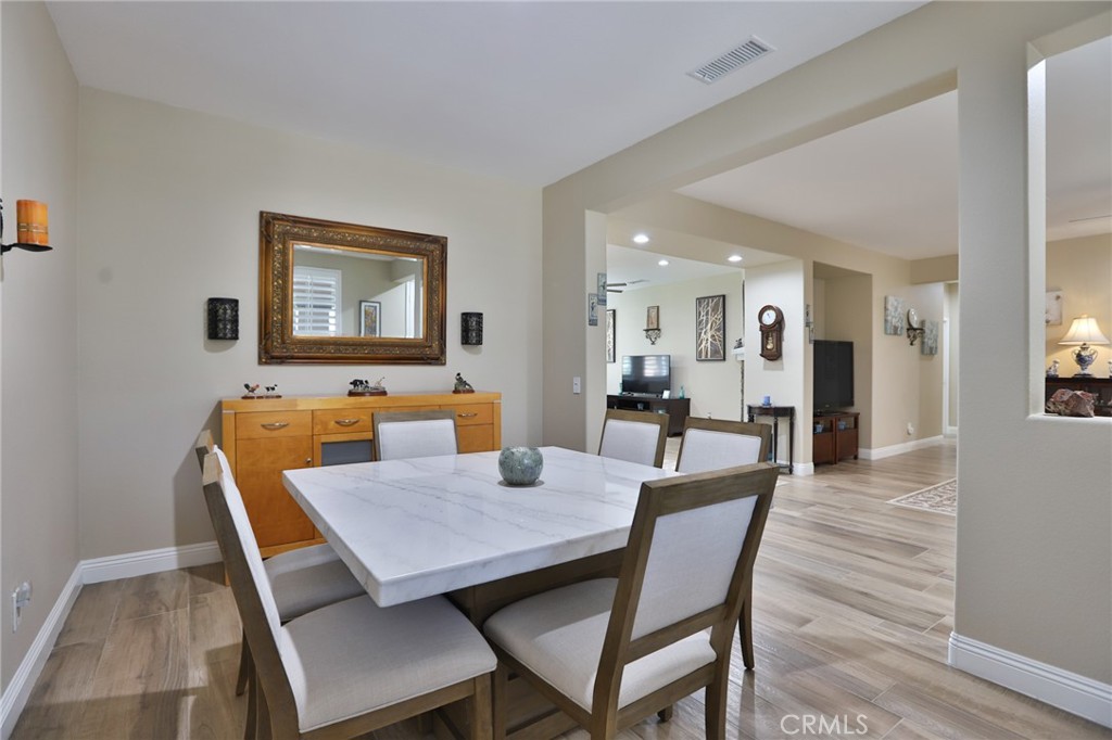 1789 Kapalua Bay Lane Corona, CA 92883 - Photo 13 of 63 a view of a dining room with furniture