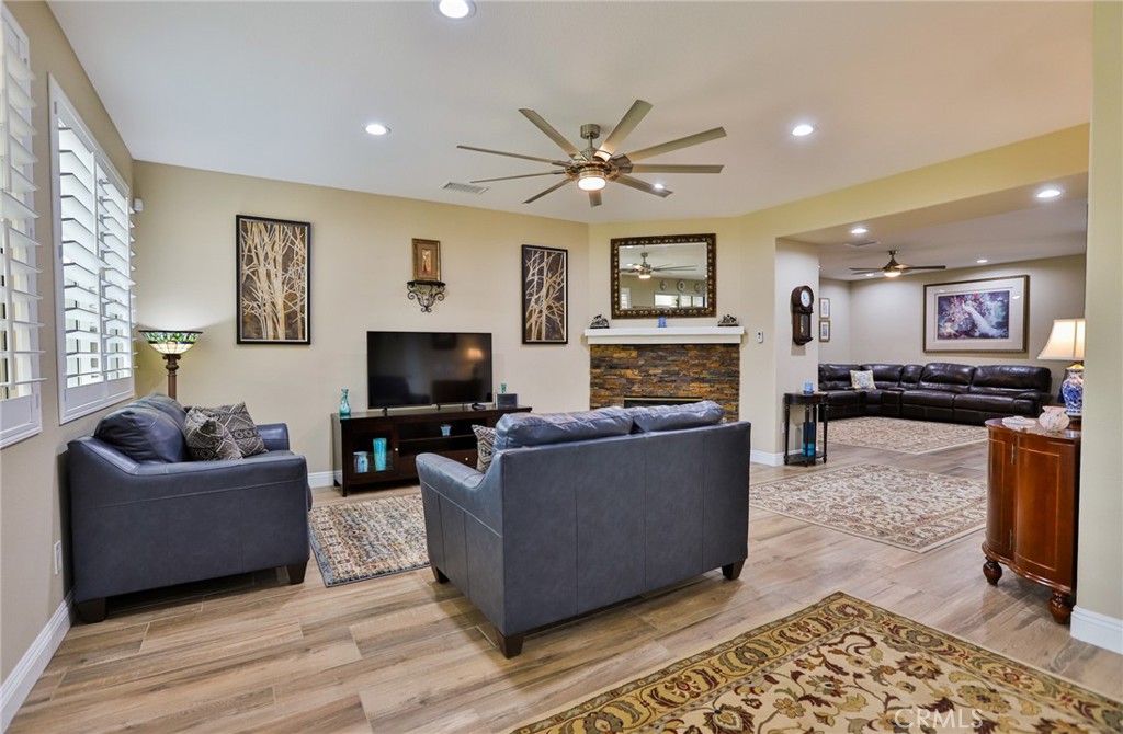1789 Kapalua Bay Lane Corona, CA 92883 - Photo 16 of 63 a living room with furniture and a flat screen tv